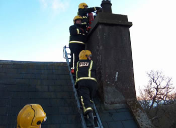 Fire fighters tackling a chimney fire at Castle Blunden